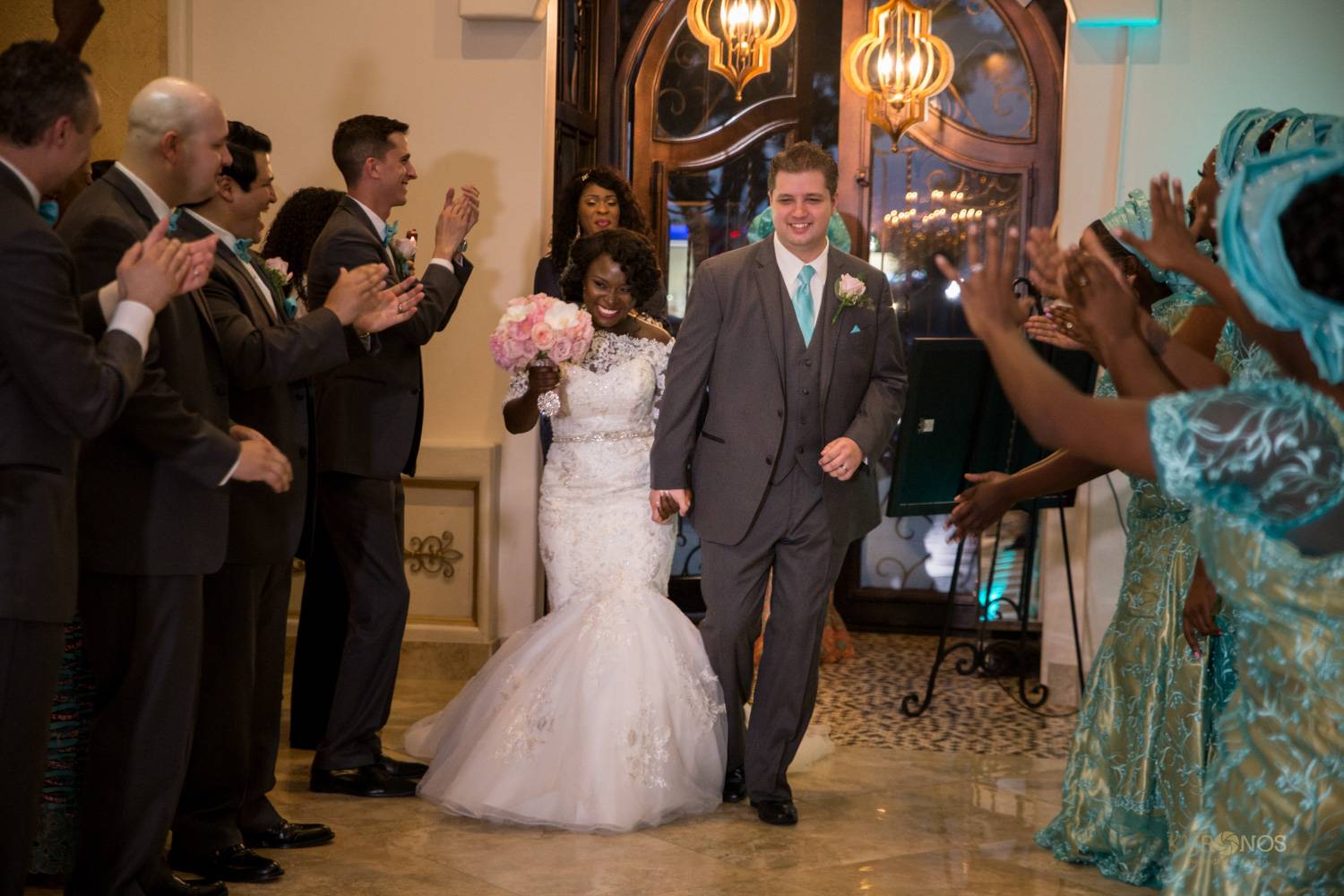 Bride and Groom entering Houston event hall for wedding reception - Alegria Gardens