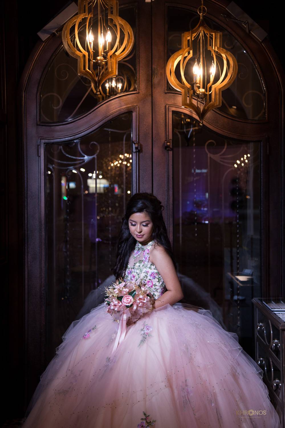 Birthday celebrant wearing flowery pink gown with bouquet - Houston Private Event Venue - Alegria Gardens
