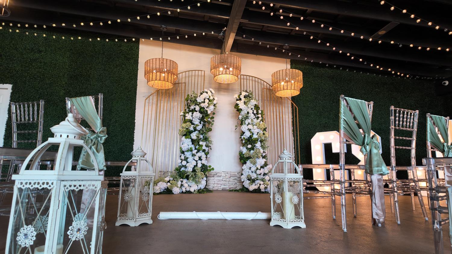Decorated wedding arch designed by Alegria Gardens.