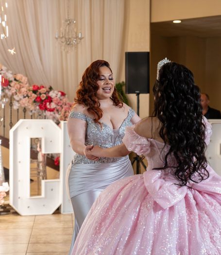 Elegant Houston event hall interior organized and decorated by Alegria Gardens featuring warm lighting, spacious seating, and tasteful decor for weddings and special occasions.
